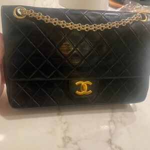 CHANEL Quilted Black Shoulder Bag with Gold Accents